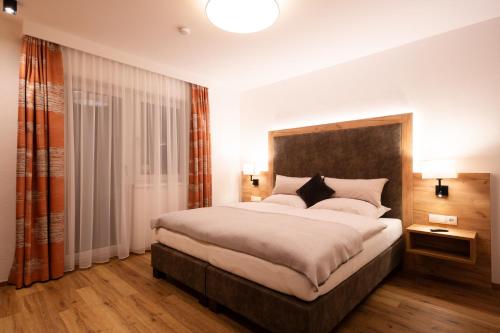 Postel nebo postele na pokoji v ubytování da Peatala Apartments