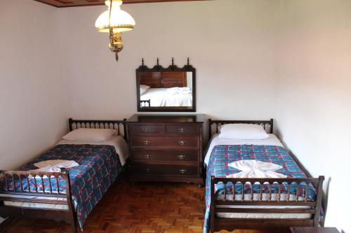 En eller flere senge i et værelse på Casa Aconchegante no Capivari