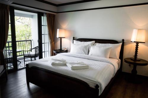 Un ou plusieurs lits dans un hébergement de l'établissement MORA Boutique Hotel