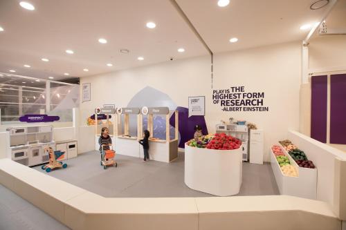 a grocery store with fruits and vegetables on display at Lotte Hotel Jeju in Seogwipo