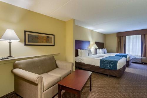 a hotel room with a bed and a couch at Comfort Suites Near Gettysburg Battlefield Visitor Center in Gettysburg
