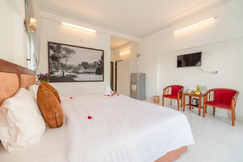 Ένα ή περισσότερα κρεβάτια σε δωμάτιο στο Hanh Nhung Villa