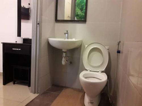 a bathroom with a toilet and a sink at Win Win in Genting Highlands