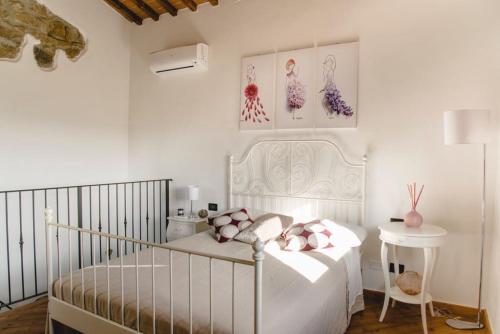 En eller flere senge i et værelse på Il Fienile di Tigliano