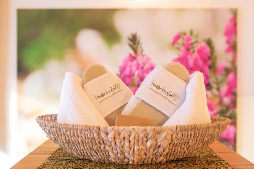a basket of sandals sitting on a table at Kronhofer – Apartments & Erlebnis-Imkerei in Hermagor