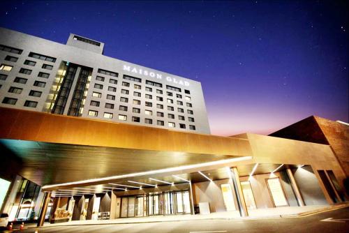 a large building with a samsung sign on top of it at Maison Glad Jeju in Jeju