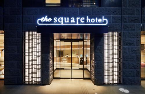 a building with a sign that reads the square hotel at the square hotel KANAZAWA in Kanazawa