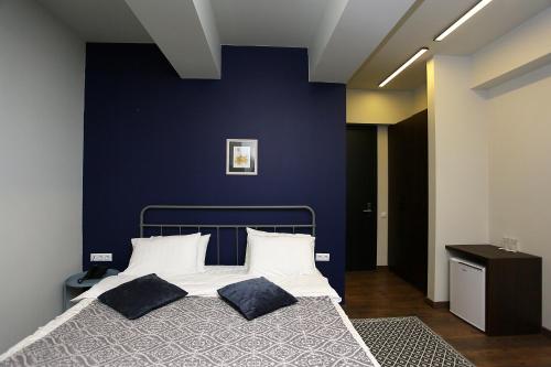 Postel nebo postele na pokoji v ubytování L.M Club Hotel