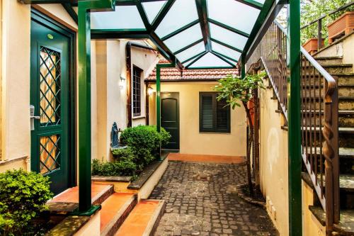 an entrance to a house with a glass roof at Hotel Buenos Aires in Rome