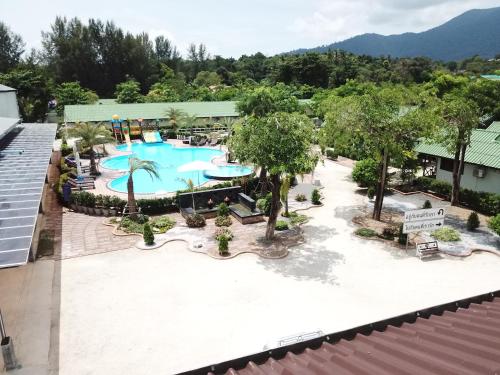 an overhead view of a pool at a resort at Walking Street Hostel in Ko Lipe