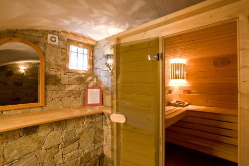 a bathroom with a stone shower and a sink at Maison Gauthier in Puy-Saint-Vincent