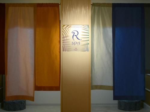 a group of different colored curtains in a room at Hotel Palm Royal Resort Kokusai Street in Naha