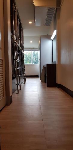 an empty room with a hallway with a room with a room at Walking Street Hostel in Ko Lipe