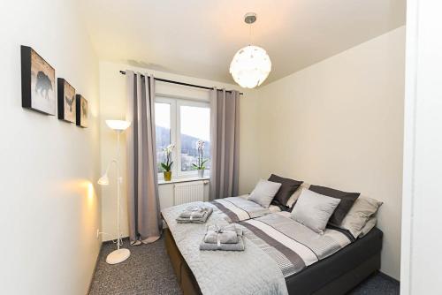 Posteľ alebo postele v izbe v ubytovaní Apartament Wróbelkowo