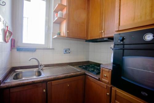 Η κουζίνα ή μικρή κουζίνα στο Domi 10 Apartment, Stazione Termini, Via Curtatone 12