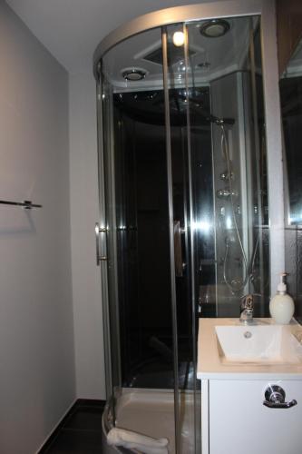 a bathroom with a shower and a sink at BCN Condal Hostal in Barcelona