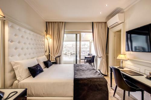 Postel nebo postele na pokoji v ubytování Hotel Domus Mea
