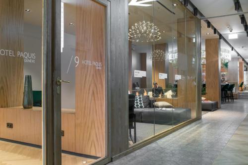 a store with glass doors and a lobby at 9Hotel Paquis in Geneva