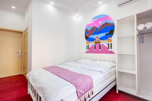 Katil atau katil-katil dalam bilik di WHITE HOTEL & HOSTEL