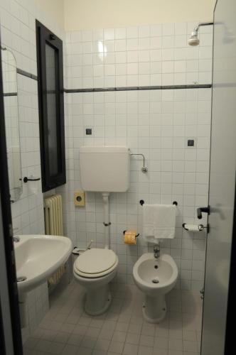 a bathroom with a toilet and a sink at Park Hotel in Castrocaro Terme