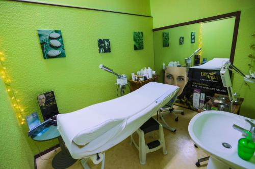 a dental room with a sink and a mirror at ibis Sète Balaruc les Bains Bien-être et Spa in Balaruc-les-Bains