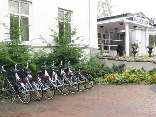 a row of bikes parked in front of a building at Blommenhof Hotel in Nyköping