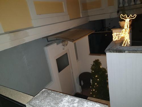 a kitchen with a christmas tree and a room with a door at Villa Elisabeth in Admont