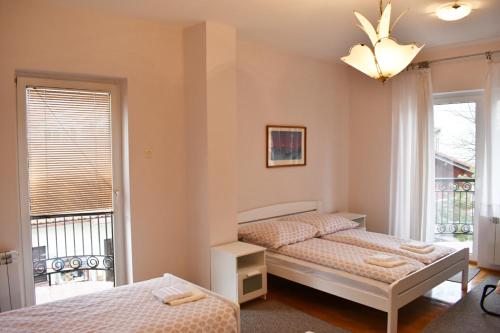 Ένα ή περισσότερα κρεβάτια σε δωμάτιο στο Danube star 2