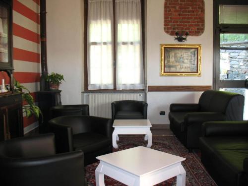 a waiting room with couches and a table at Albergo Ristorante Monterosa in Ameno