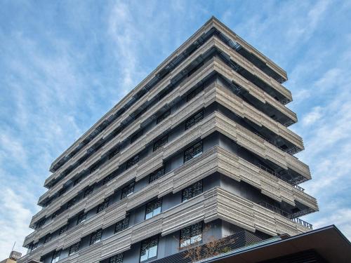 a tall building with a sky in the background at Tokyu Stay Kyoto Sakaiza Shijo Kawaramachi in Kyoto