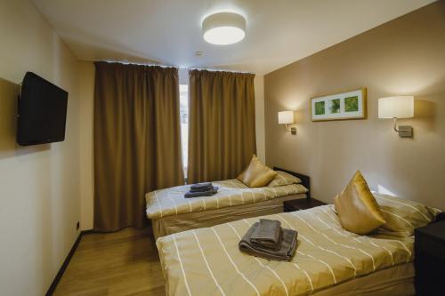 Tempat tidur dalam kamar di Mini Hotel Rooms & Breakfast