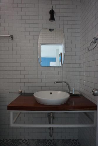 a white bathroom with a sink and a mirror at Chill Days @ Koh Larn in Ko Larn
