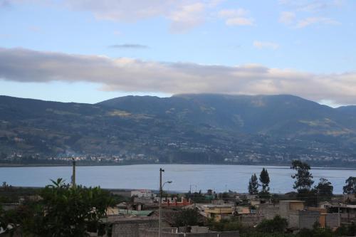 a view of a city and a large body of water at Green House Araque Inn in Otavalo