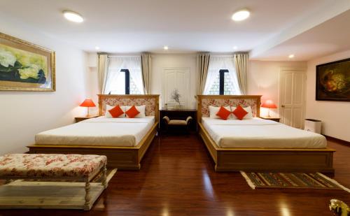 Giường trong phòng chung tại Lamarque Dalat Villa
