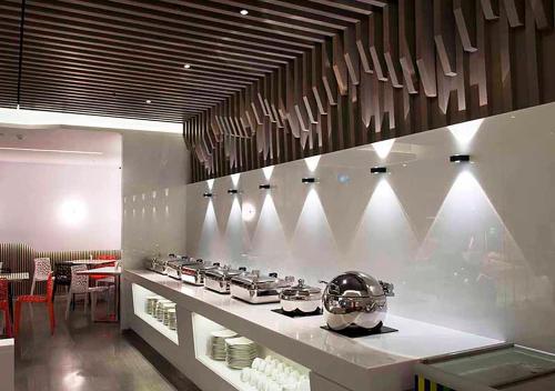 a kitchen with a counter with pots and pans at Royal Hotel Group- Central Park Branch in Kaohsiung