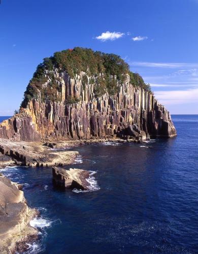 an island in the ocean with a rocky shore at Hotel Nami in Kumano