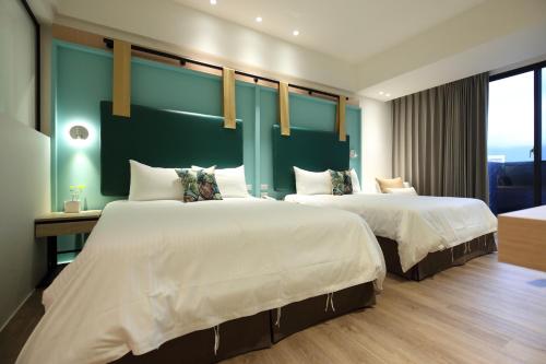 Postel nebo postele na pokoji v ubytování Hai Sheng Wei B&B