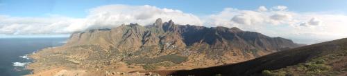 an aerial view of a mountain with the ocean at FARINHA DE PAU - ECO B&B in Tarrafal