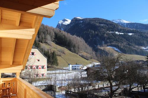 a view of a mountain from a porch of a house at Schlosswirt Chalets & Apartments in Großkirchheim