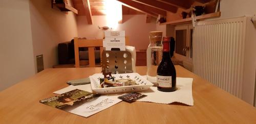a bottle of wine sitting on top of a table at Ferienhaus Gundi in Pettneu am Arlberg