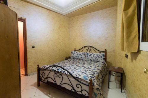 a bedroom with a bed in a room at Hotel Bab Boujloud in Fès