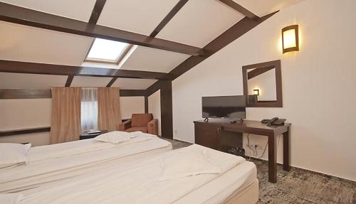 Säng eller sängar i ett rum på Hotel Regina