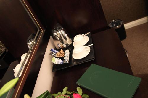a table in a hotel room with a tray of snacks at Greenvale Hotel in Cookstown