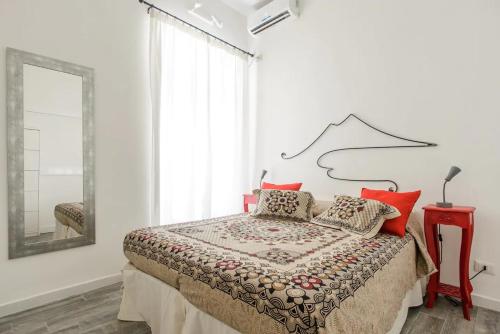 Postel nebo postele na pokoji v ubytování Vesuvius a Mezzocannone