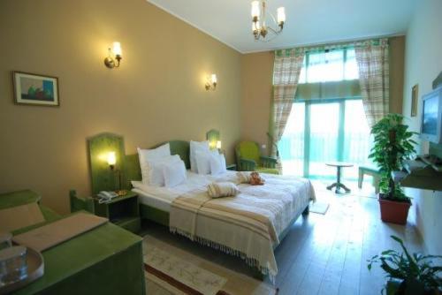 a bedroom with a large bed in a room at Ezio House in Braşov