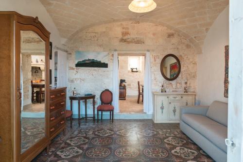 a living room with a couch and a table at Sea and the City Apartments by Wonderful Italy in Ostuni