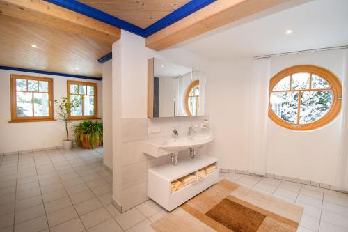 a bathroom with a sink and a mirror at Villa Salza in Sankt Martin am Grimming
