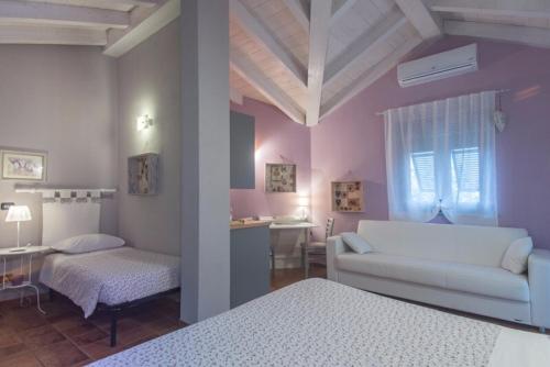 מיטה או מיטות בחדר ב-Agriturismo Terra e Cielo