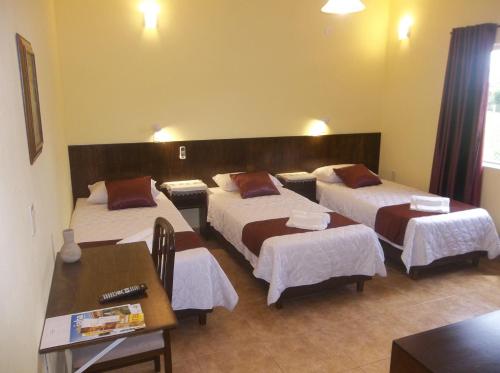 Ένα ή περισσότερα κρεβάτια σε δωμάτιο στο Posada Maria