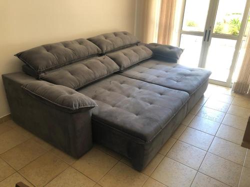 Khu vực ghế ngồi tại Condominio Pantai Enseada Guarujá